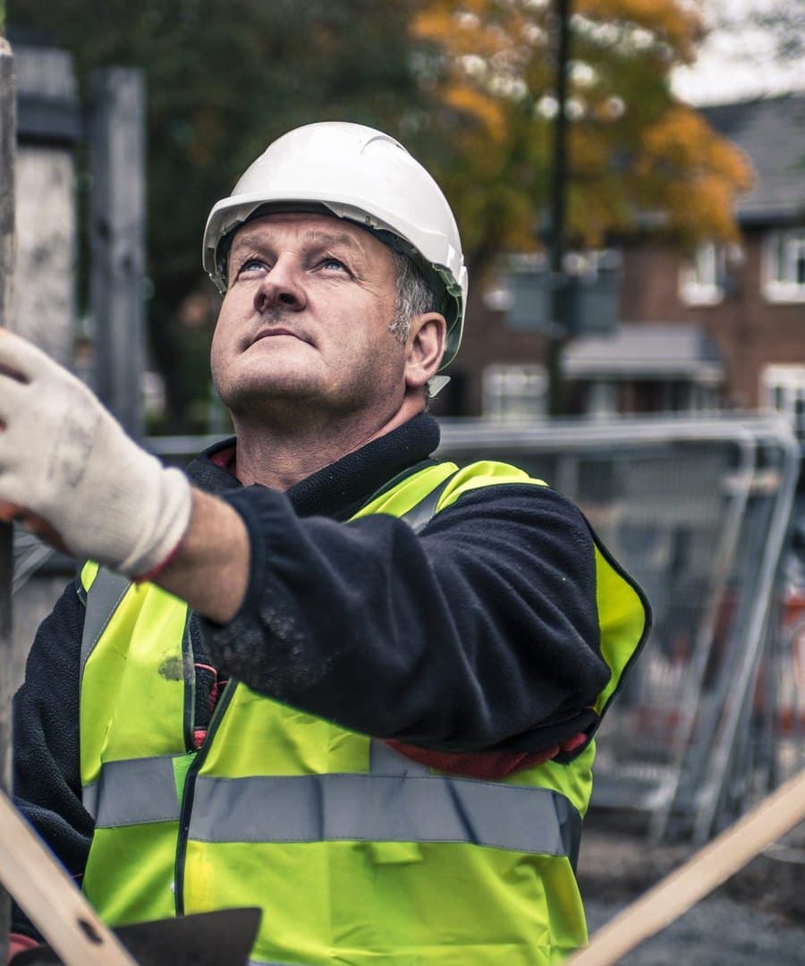 Contractor checking a level on the job, hands occupied