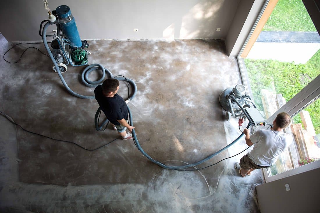 Restoration crew operating floor equipment