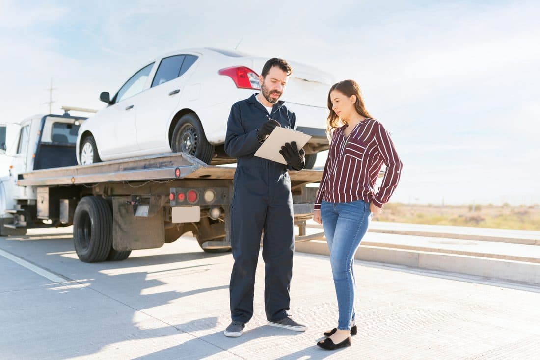 Tow operator helping a customer roadside